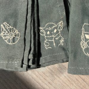 Trois serviettes de table vertes, avec des broderies Star Wars
